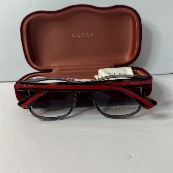 Gucci's GG0004ON soft lines across frames front.Iconic web effect optyl temples - Picture 10 of 14